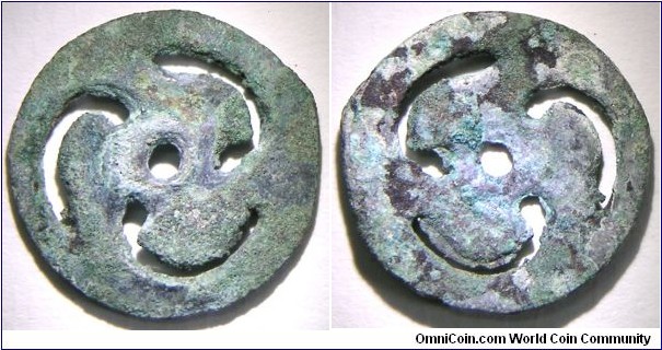 Ordos Late Bronze Age fire wheel money 1600BC -1200BC. Smiley?