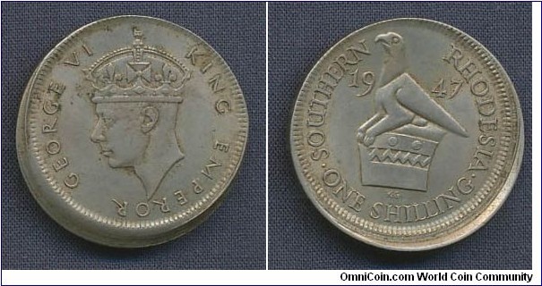 (British colony) 1 Shilling 8% offcent