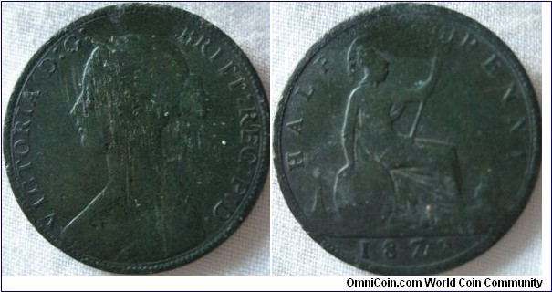 1872 halfpenny, worn and dug up, strange mark next to the 7 invisible to the eye, perhaps just the corrosion from the ground around the 7 and 2 effecting the metal