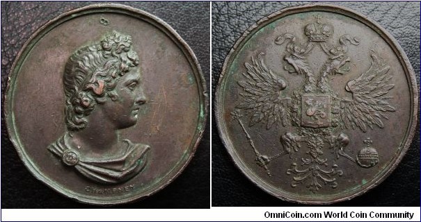 Unlisted mule, by George Champney, of Apollo Belverdere paired with a Russian Imperial Eagle with crest of Kazan copper 39mm.  Champney was in Russia in 1876, where he produced a mule from an Italian 20 lire obverse & a Russian 20 kopeck obverse. So I think that this medal mule is from around that date, seeing as both medals he used for it are Russian ones, though I have not been able to locate the exact medals used.
