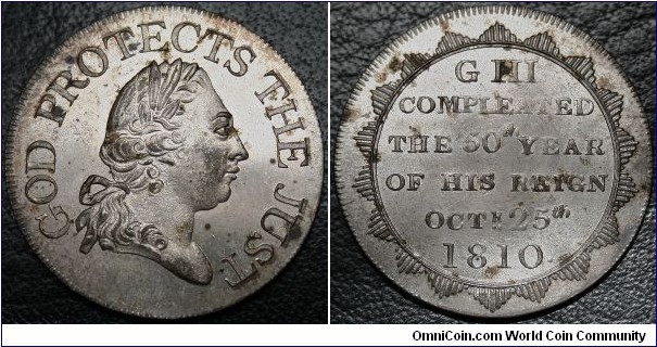 
Obv. Laureate head of George III, right. GOD PROTECTS THE JUST
Rev. Inscription within rays G III / COMPLEATED / THE 50TH YEAR / OF HIS REIGN / OCTR. 25TH / 1810.
BHM#682 25mm, AE C. AE silvered C. by Kettle & Sons. Missing Kettle's signature.