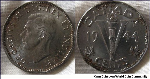 1944 5 cents, lost some chromium plating and rusted underneath, but hardly curculated