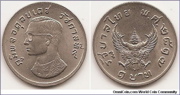 1 Baht -BE2517-
Y#100
Copper-Nickel, 25 mm.   Ruler: Bhumipol Adulyadej (Rama IX) Obv: Head left Rev: Mythical creature “Garuda” Edge: Reeded