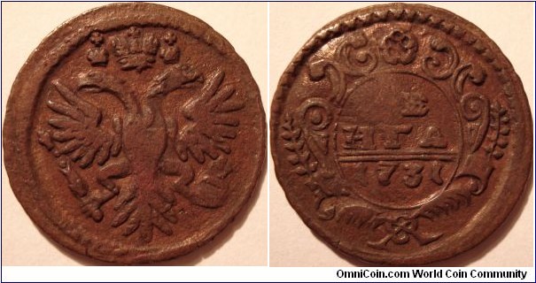 AE Denga (1/2 kopeek) 1731. Coin struck on a large BK Peer the Great kopeek. Diameter 29mm.