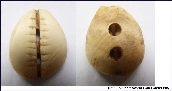 Perfect grade Bone shell coin.Shang and Zhou dynasty.20mm diameter,weight 2.2g.