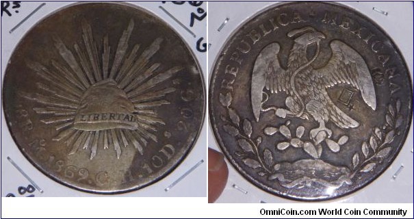 Mexican silver peso, with at least 4 chinese chop marks on the Eagle side.
Mexico City mint, Assayer GH.