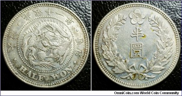 Korea 1907 half won. Nice details unfortunately cleaned with some brushmarks on the reverse and some stains. Weight: 10.1g. 