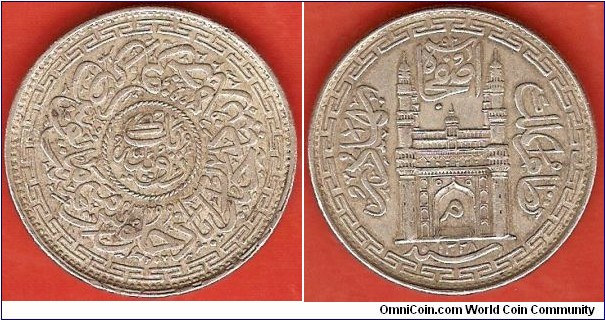 Issued for Hyderabad: 1 Rupee in 0.818 silver.
Year AH 1328/43
