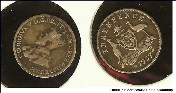 1927 Threepence. Has a small dot between the kangaroo's back and the 'H'