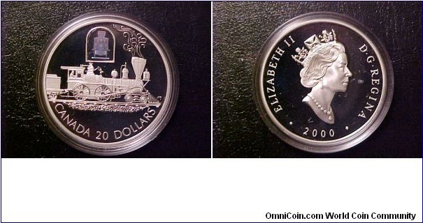 One of two recent additions to my trains on coins collection, the 2000 Canadian Transportation series, $20 1-ounce silver coin commemorating The Toronto historic locomotive.  A very pretty coin and a classic locomotive!  These coins have the added bonus of the hologram of the locomotive from another angle above the struck image.