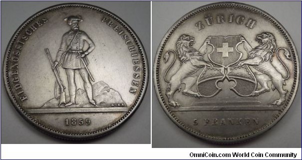 Swiss Zurich 5 Francs Shooting Thaler by Ferdinand Korn/Eidg Munzstatte, Silver 38 MM. Mintage 6,000
obv: hunsman standing with gun resting at feet. Rev: city arm 3 shields with lions supporters
