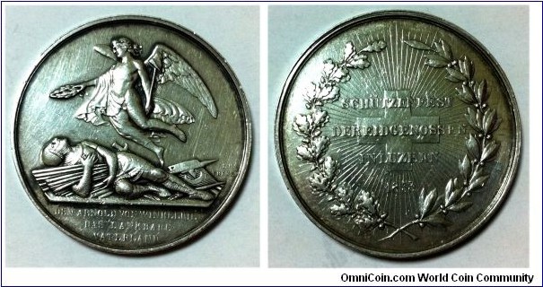 1853 Swiss Luzern Eidg Schutzenfest Medal by Johann Baptist Frener. Silver 41MM. Mintage: 2,000
Obv: DEM ARNOLD VON WINKELRIED DAS DANKBARE VATERLAND / Angel hovering over fallen hero Arnold Winkelried pierced with enemy spears. Rev: SCHUTZENFEST DER EIDGENOSSEN IN LUZERN 1853 / Swiss cross in rays with wreath and legend.
