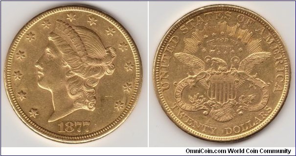 SOLD/1877Eagle

Mintage:
Circulation strikes: 397,650
Proofs: 20

Designer: James Barton Longacre

Diameter: ±34 millimeters

Metal content:
Gold - 90%
Other - 10% 

Weight: ±516 grains (±33.4 grams)

Edge: Reeded

Mintmark: None (for Philadelphia, PA) below the eagle's tail on the reverse