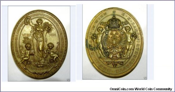 1890 Austria Holy Roman Emprie Cities in The Habsburg land Vienna Medal by H. Jauner Franz. Bronze: 82 X 67MM/162 gm.
Obv: Agriculture and Forestry Economic Society in Vienna. Female figure with a laurel wreath in her raised right hand and cornucopia in her left arm is vv, you sit at the feet of two geniuses in agricultural attributes. Rev: Two cornucopias geniuses with an escutcheon, crowned double eagle to keep around, religious chain, top crown.
