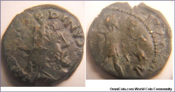 Double struck or struck over reverse -Victorinus. Sol walking left, holding whip, right hand raised, star in left field.