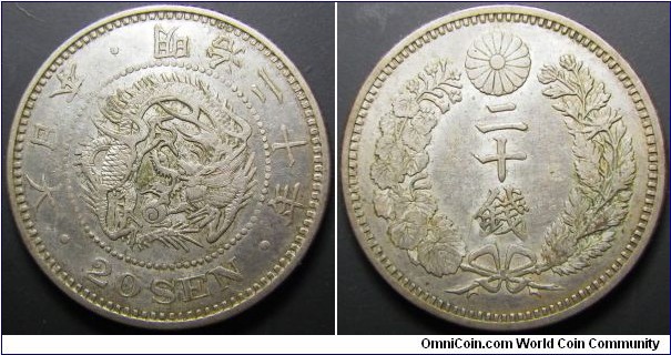 Japan 1887 20 sen. Nice condition but seems like it's struck a bit flat on one side. Weight: 5.42g. 