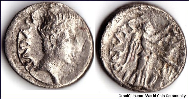 Augustus silver quinarius minted at Emerita (Spain). Obverse Augustus. Reverse victory crowning trophy